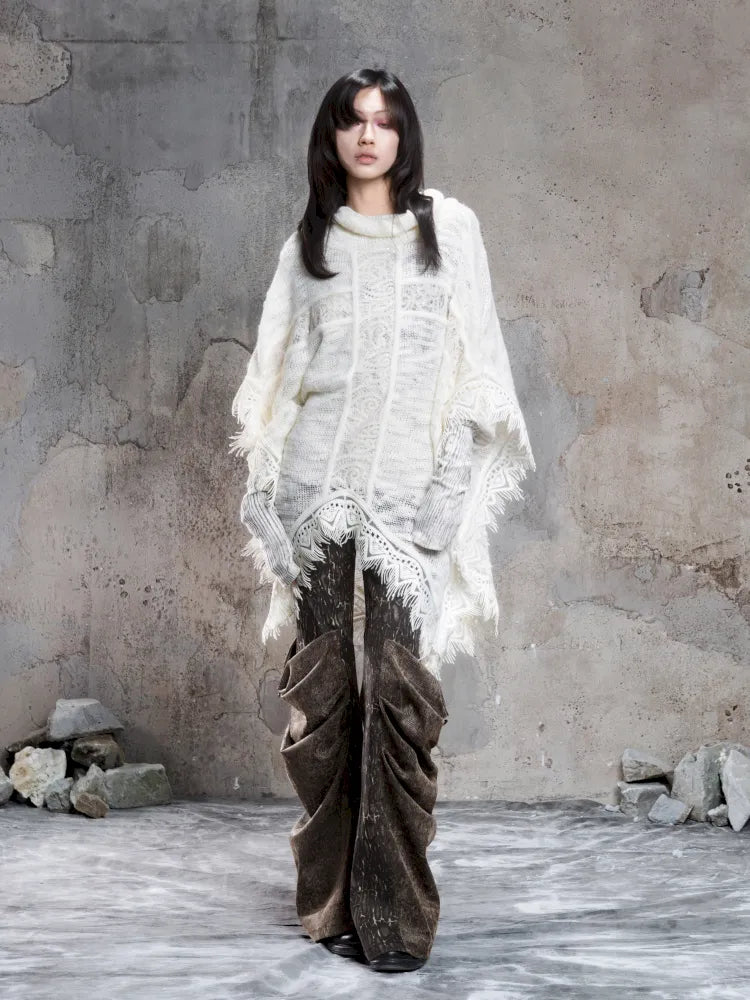 Asymmetrical fringe detailing on a niche knit top【s0000014136】