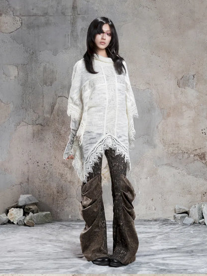 Asymmetrical fringe detailing on a niche knit top【s0000014136】