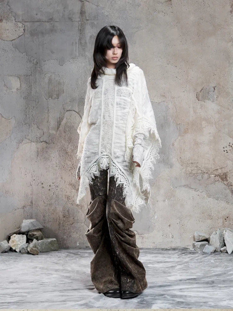 Asymmetrical fringe detailing on a niche knit top【s0000014136】