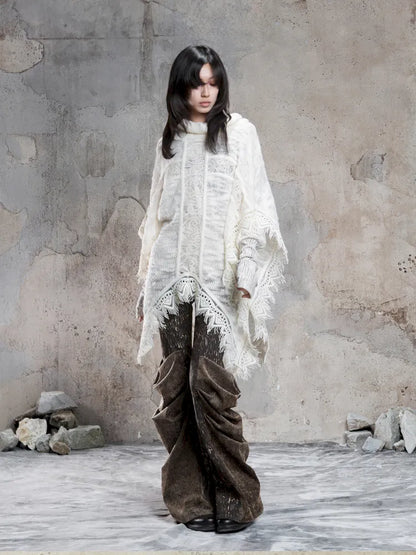 Asymmetrical fringe detailing on a niche knit top【s0000014136】